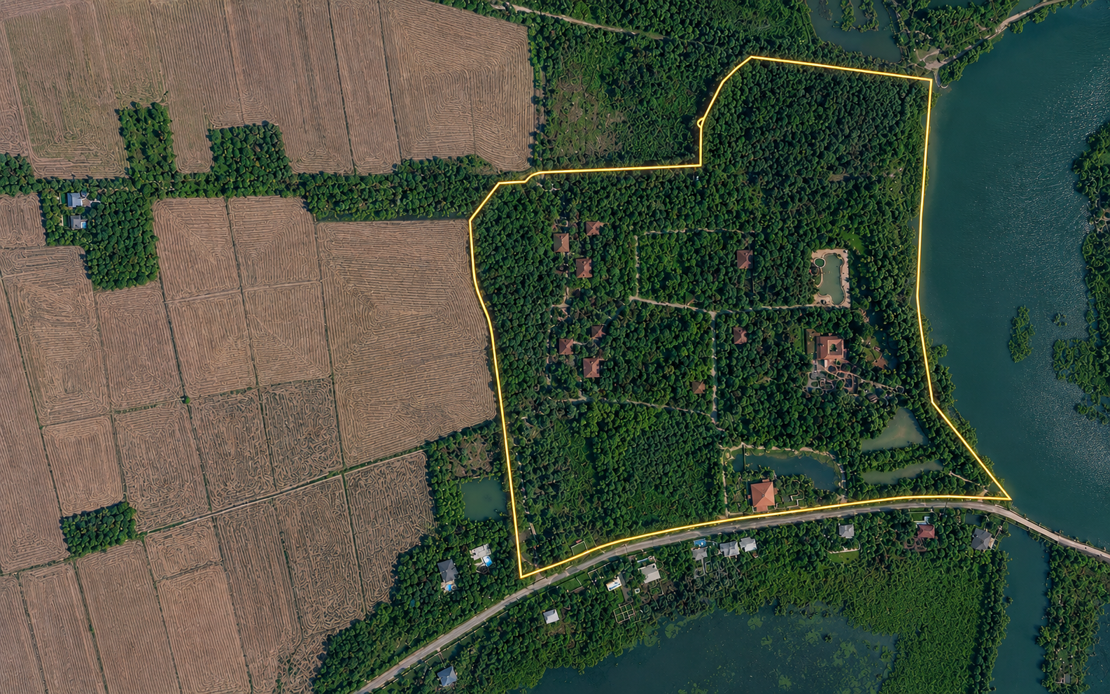Aerial view of the 14.41-acre Kumarakom estate with property boundary marked