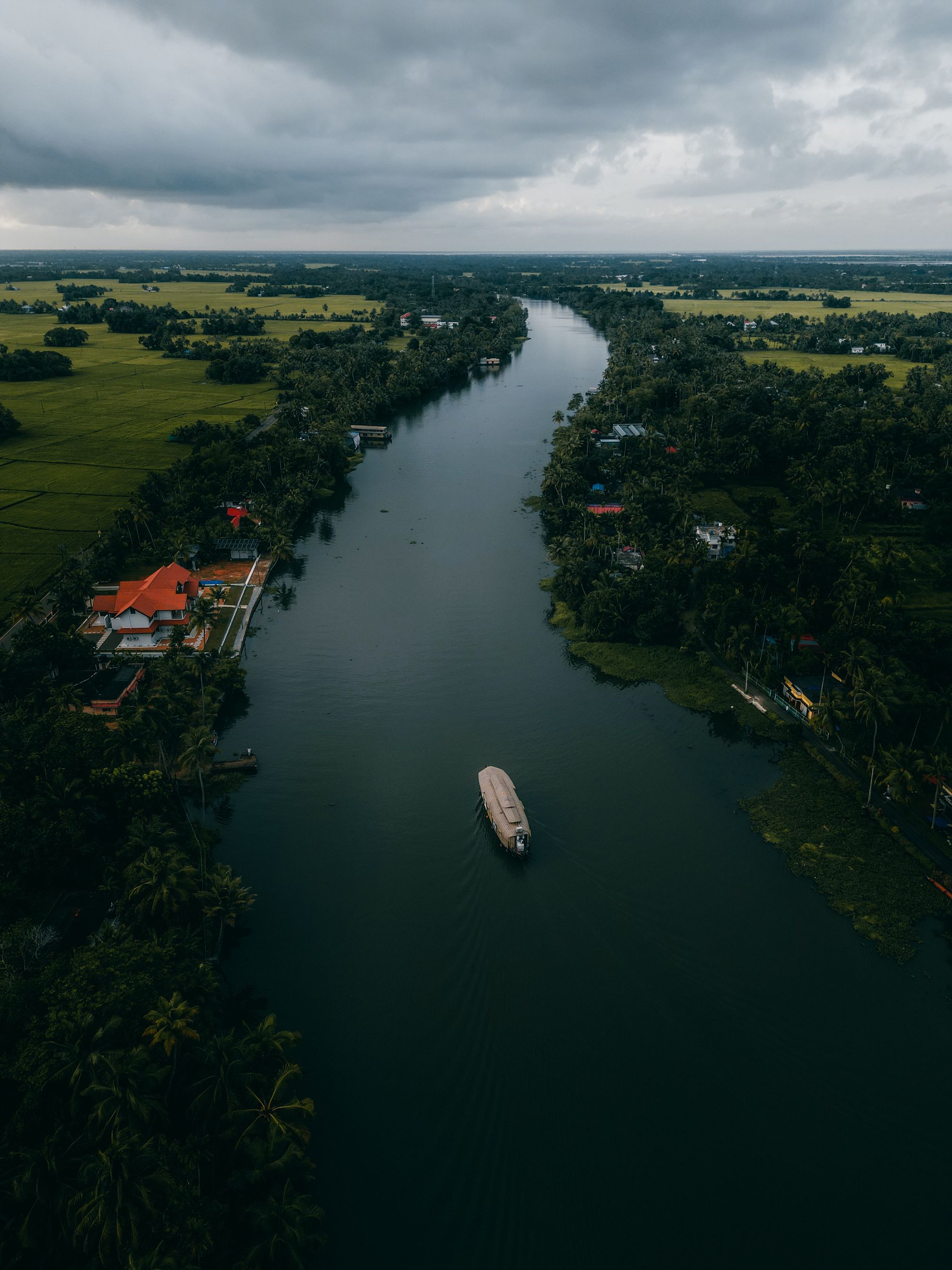 Aerial view of Vembanad backwaters — the sacred waters of Kumarakom
